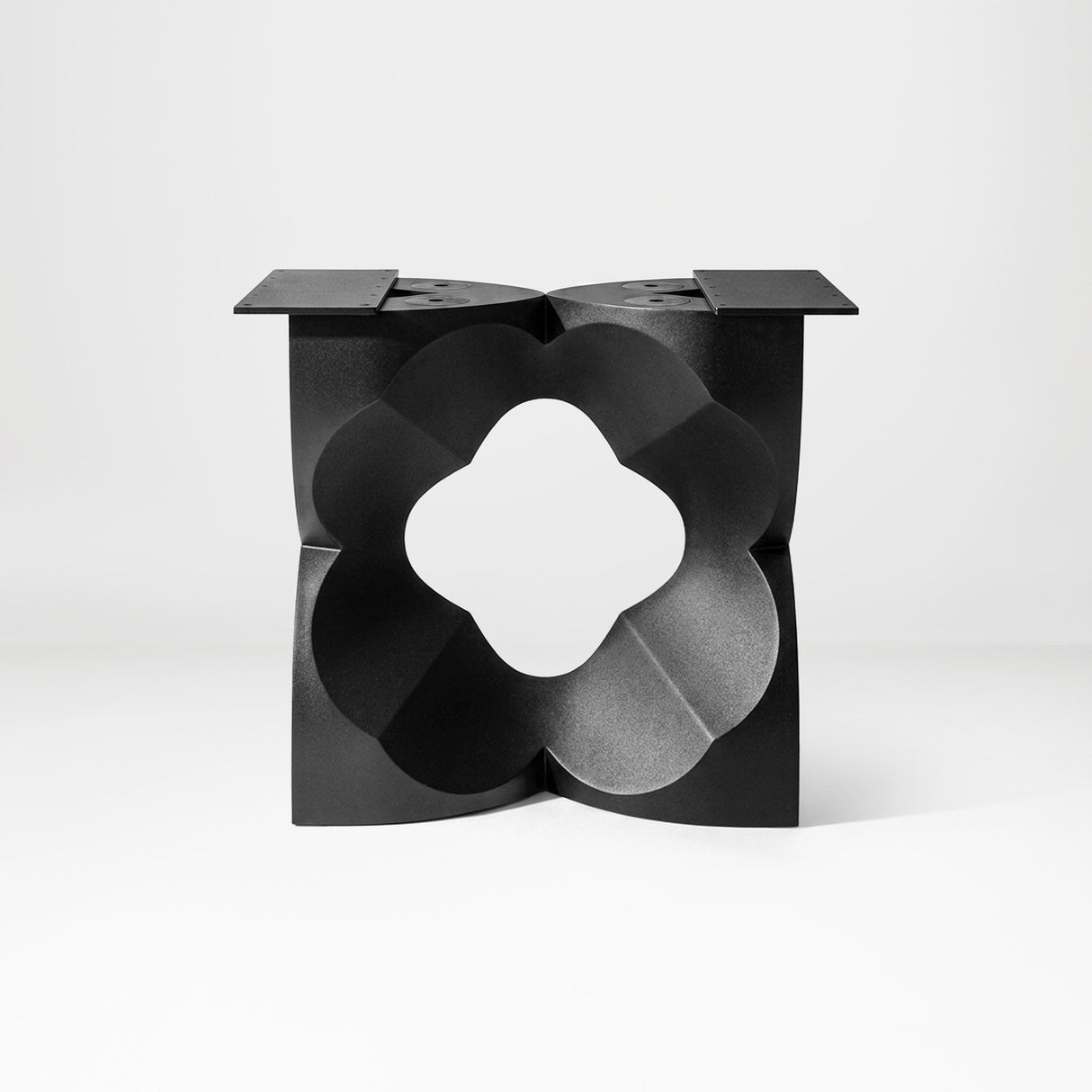 Black Coffee Table Base 134 Chloris Petal 16" H – botanical flower-inspired pedestal base handcrafted from heavy-duty powder-coated steel in matte black. This sculptural metal base features a compact petal silhouette and a sturdy foundation (500 lbs capacity; 16"x16"x16"), specifically engineered to support a heavy live-edge tabletop, round wood top, or marble slab. A premium DIY steel table base that brings an organic, modern statement to luxury living rooms and sunrooms.