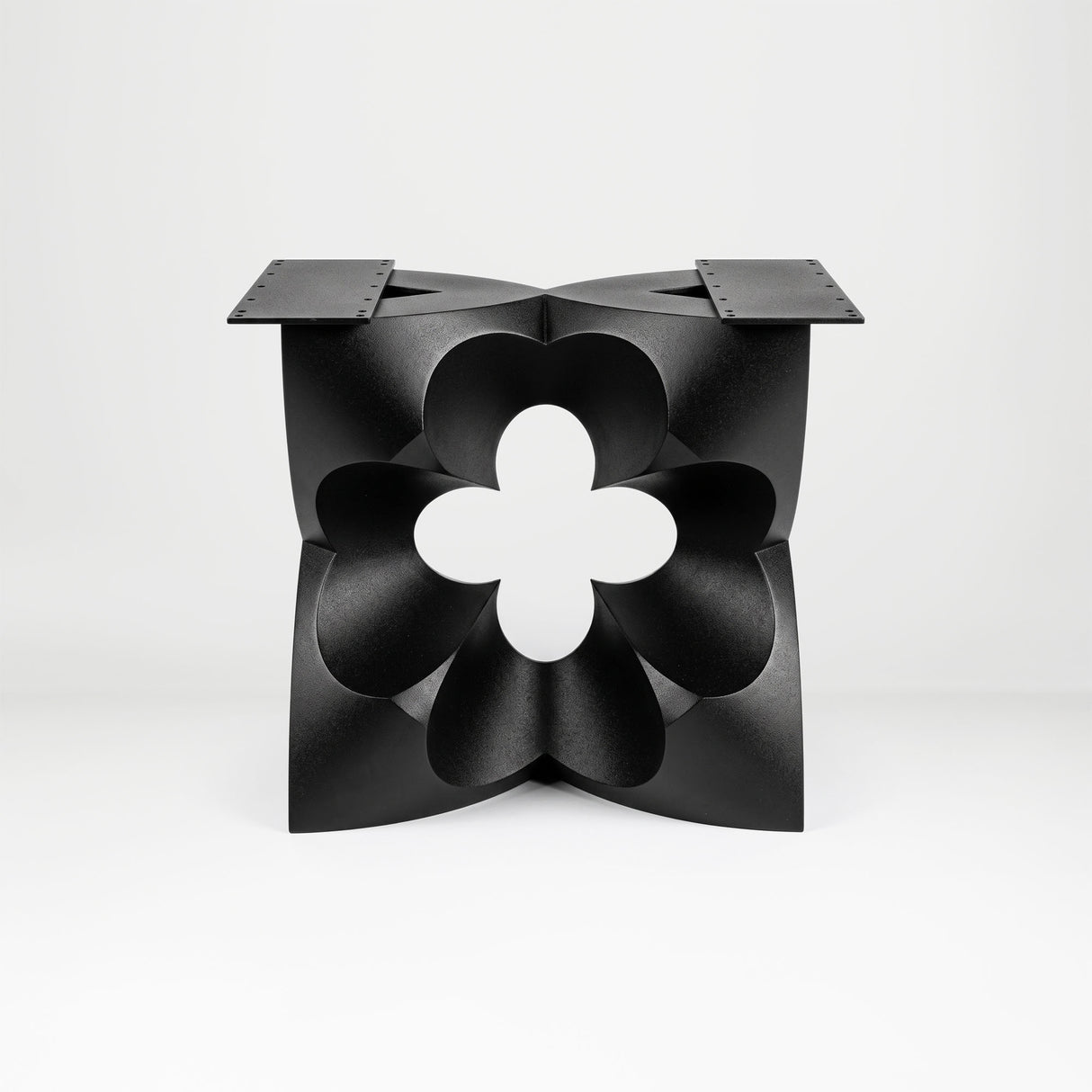 Black Coffee Table Base 134 Chloris Petal 16" H – botanical flower-inspired pedestal base handcrafted from heavy-duty powder-coated steel in matte black. This sculptural metal base features a compact petal silhouette and a sturdy foundation (500 lbs capacity; 16"x16"x16"), specifically engineered to support a heavy live-edge tabletop, round wood top, or marble slab. A premium DIY steel table base that brings an organic, modern statement to luxury living rooms and sunrooms.