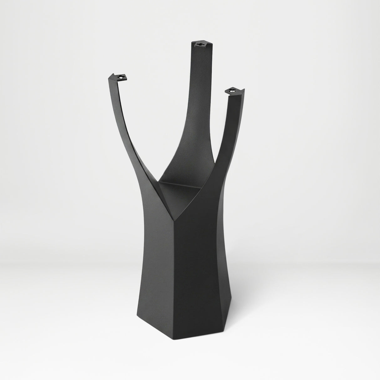 Black Metal Counter Base 608 Namu 36" H – Scandinavian-inspired pedestal base featuring a unique tree-stump silhouette handcrafted from heavy-duty powder-coated steel in matte black. This artisanal metal counter-height base features a hollow design for gravel-filling to maximize stability and an ultra-sturdy foundation (1,000 lbs capacity; 13.8"L x 12.3"W). A premium DIY steel counter base engineered with a precision-drilled triangular mounting plate (15.4" sides) to securely support a heavy live-edge table