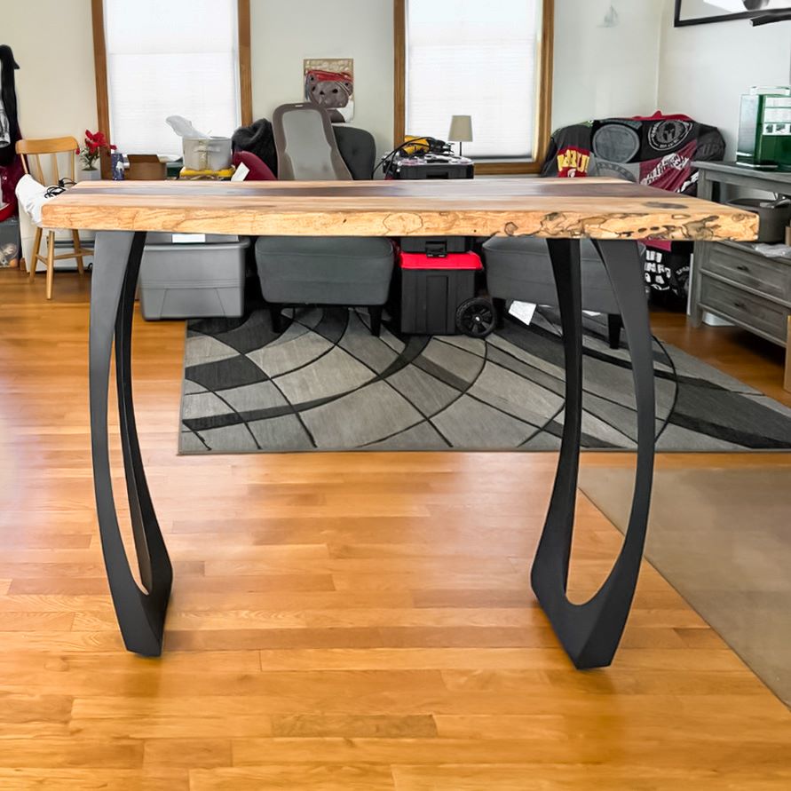 Real-life home setting featuring 603 Cleo 34.3" H metal leg for counter table with natural wood top.