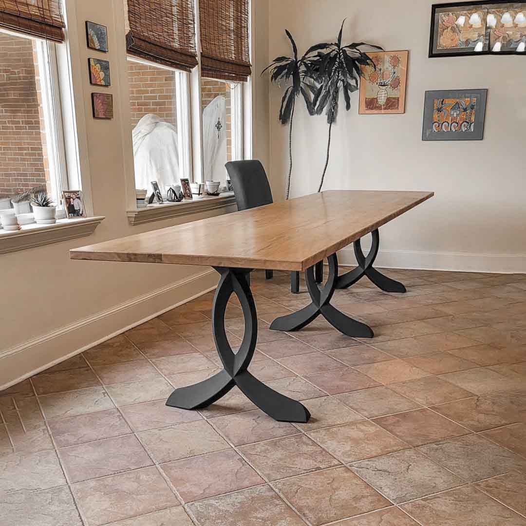 Home office desk with 423 Curva 28" H curved design metal table legs under a solid wood top.
