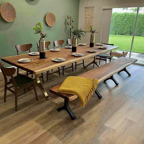 contemporary epoxy resin river table supported by wishbone bench legs