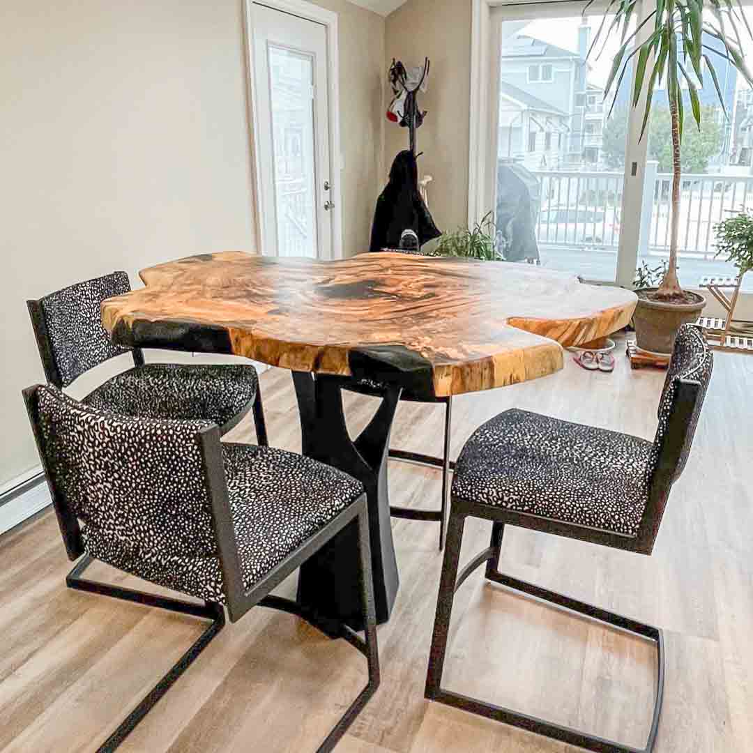 36" H counter metal table base with tree bark texture finish in family dining room setting