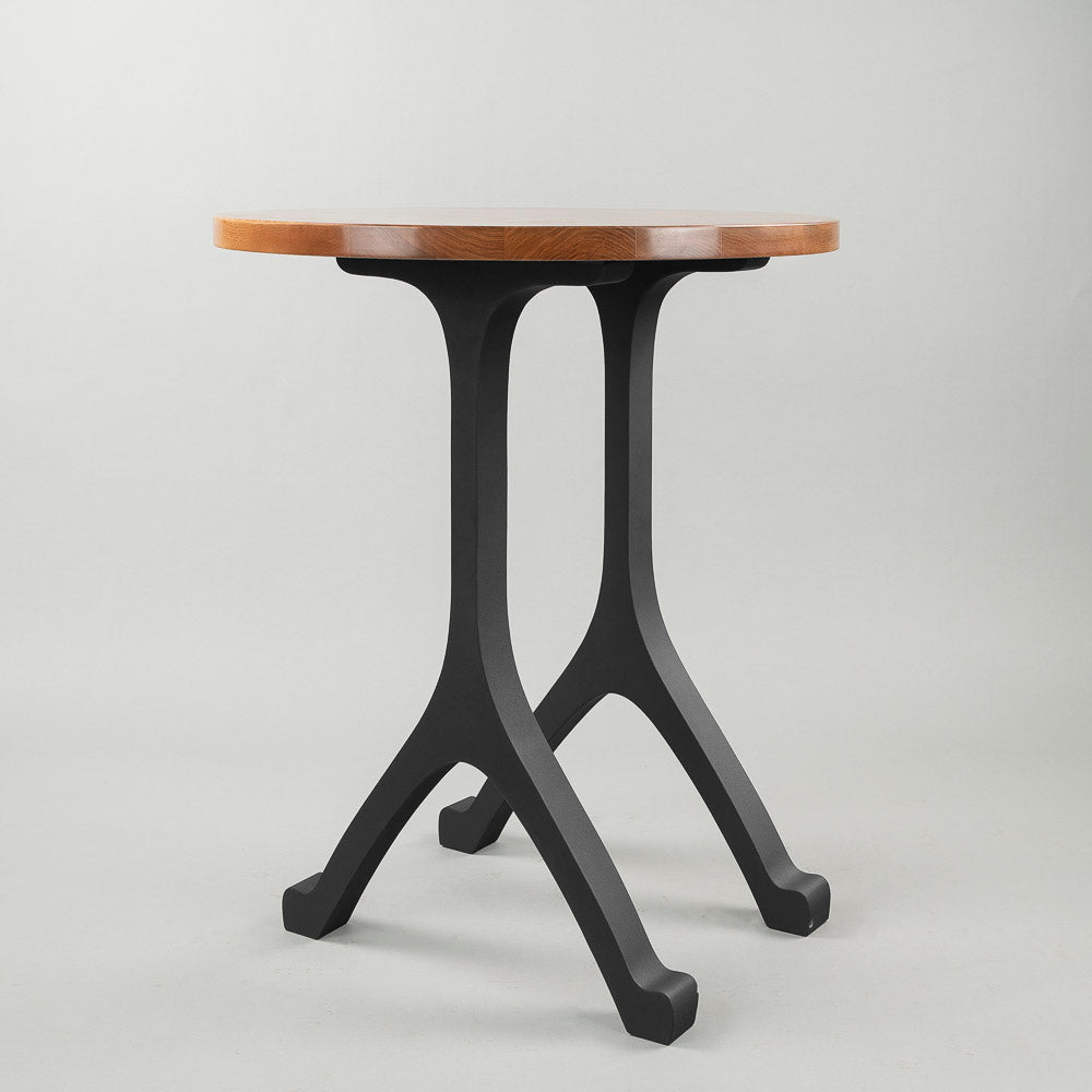 Side angle of counter table featuring stylish 612 Wishbone 34" H counter table legs metal construction and minimalist wooden top.
