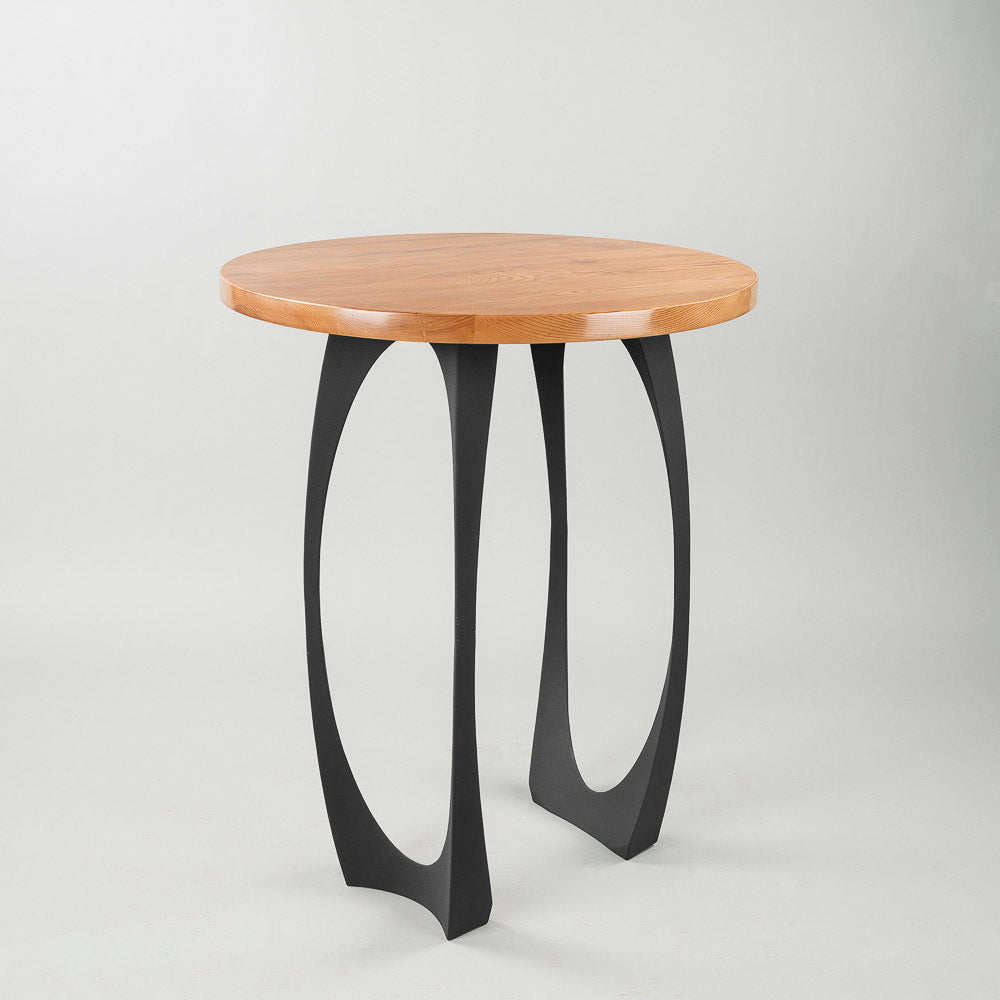 Round wood tabletop supported by 603 Cleo 34.3" H counter table legs metal with sleek curved design.