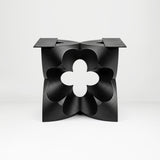 Black Coffee Table Base 134 Chloris Petal 16" H – botanical flower-inspired pedestal base handcrafted from heavy-duty powder-coated steel in matte black. This sculptural metal base features a compact petal silhouette and a sturdy foundation (500 lbs capacity; 16"x16"x16"), specifically engineered to support a heavy live-edge tabletop, round wood top, or marble slab. A premium DIY steel table base that brings an organic, modern statement to luxury living rooms and sunrooms.