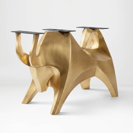 Gold Table Base 803 Bullos 28.5" H – luxury bull-inspired pedestal base handcrafted from stainless steel with a brushed gold finish. This sculptural metal base features powerful muscular curves and a wide sturdy foundation (1,000 lbs capacity), ideal for large custom dining tables or executive boardrooms. A premium DIY furniture base and heavy-duty steel table base designed for marble, glass, or wood tops in high-end modern interiors.