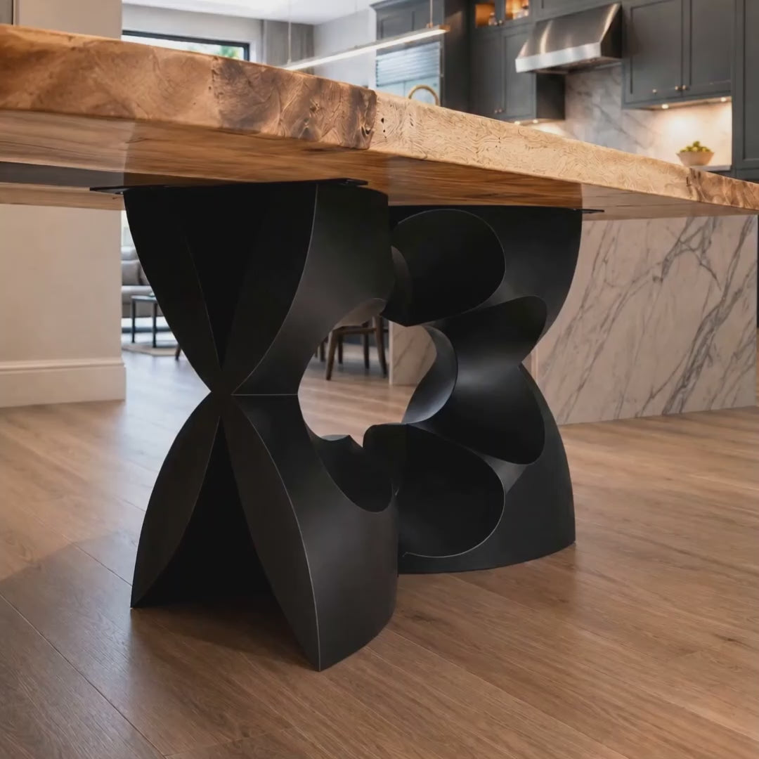 Metal Table Base 344 Chloris Petal 28.5" H – flower-inspired pedestal base handcrafted from heavy-duty powder-coated steel in matte black. This heavy-duty sculptural metal base features an elongated botanical petal silhouette and a sturdy foundation (1,000 lbs capacity; 34"L x 18"W). A premium DIY steel table base and modern furniture foundation specifically engineered to support a heavy live-edge tabletop, rectangular wood top, or marble slab in dining rooms.