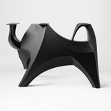 Metal Table Base 803 Bullos 28.5" H – bold bull-inspired pedestal base handcrafted from heavy-duty powder-coated steel in matte black. This sculptural metal base features powerful muscular curves and a wide sturdy foundation (1,000 lbs capacity), perfect for large custom dining tables, designer cafes, or boutique displays. A premium DIY furniture base and heavy-duty steel table base designed for marble, glass, or wood tops in industrial, minimalist, and Scandinavian interiors.