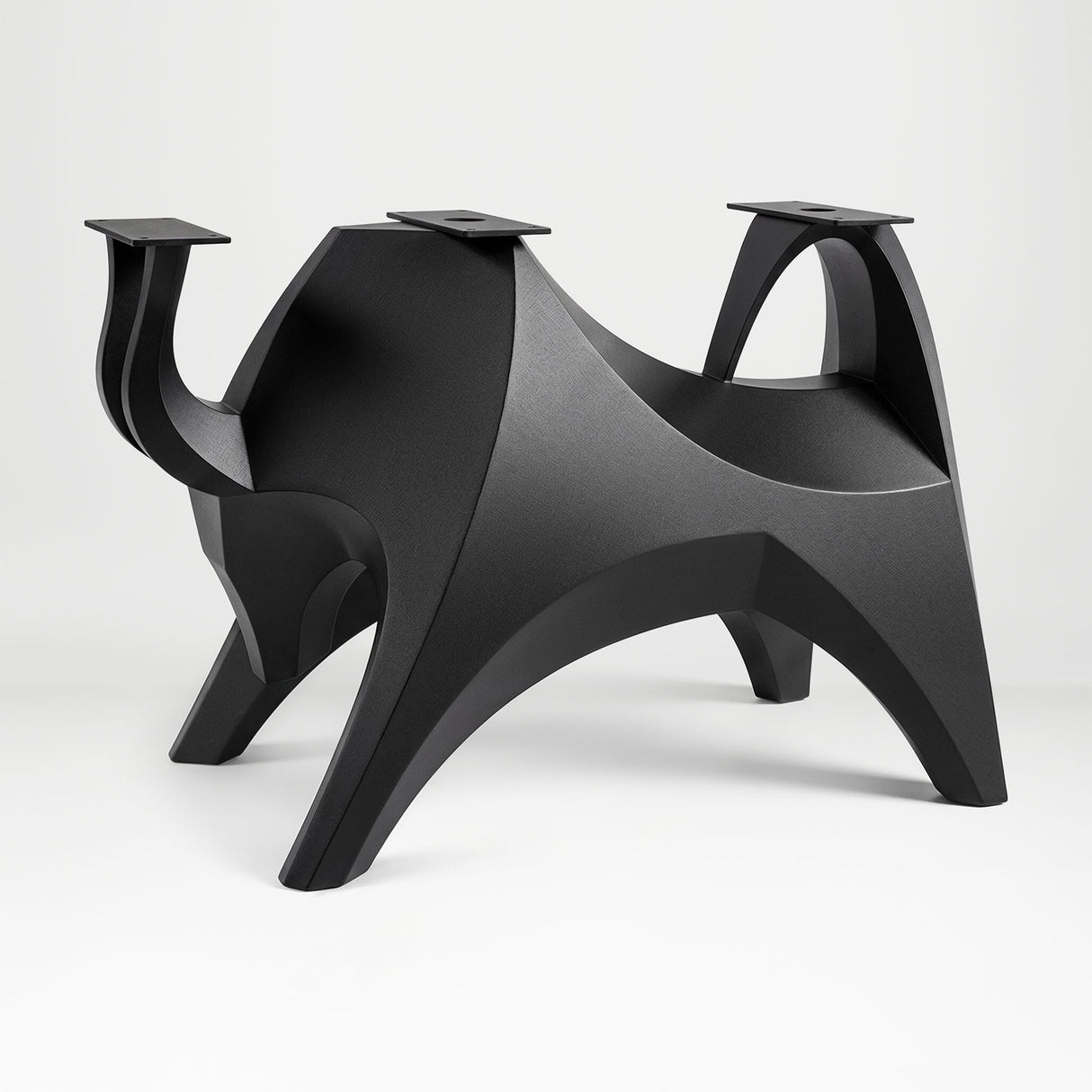 Metal Table Base 803 Bullos 28.5" H – bold bull-inspired pedestal base handcrafted from heavy-duty powder-coated steel in matte black. This sculptural metal base features powerful muscular curves and a wide sturdy foundation (1,000 lbs capacity), perfect for large custom dining tables, designer cafes, or boutique displays. A premium DIY furniture base and heavy-duty steel table base designed for marble, glass, or wood tops in industrial, minimalist, and Scandinavian interiors.