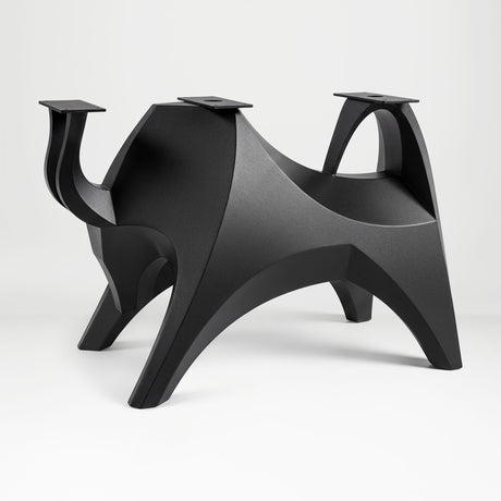 Metal Table Base 803 Bullos 28.5" H – bold bull-inspired pedestal base handcrafted from heavy-duty powder-coated steel in matte black. This sculptural metal base features powerful muscular curves and a wide sturdy foundation (1,000 lbs capacity), perfect for large custom dining tables, designer cafes, or boutique displays. A premium DIY furniture base and heavy-duty steel table base designed for marble, glass, or wood tops in industrial, minimalist, and Scandinavian interiors.