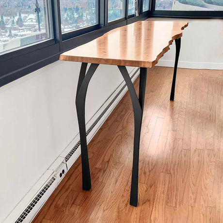 Metal legs for counter table 40 inch height creating elevated display counter in retail boutique