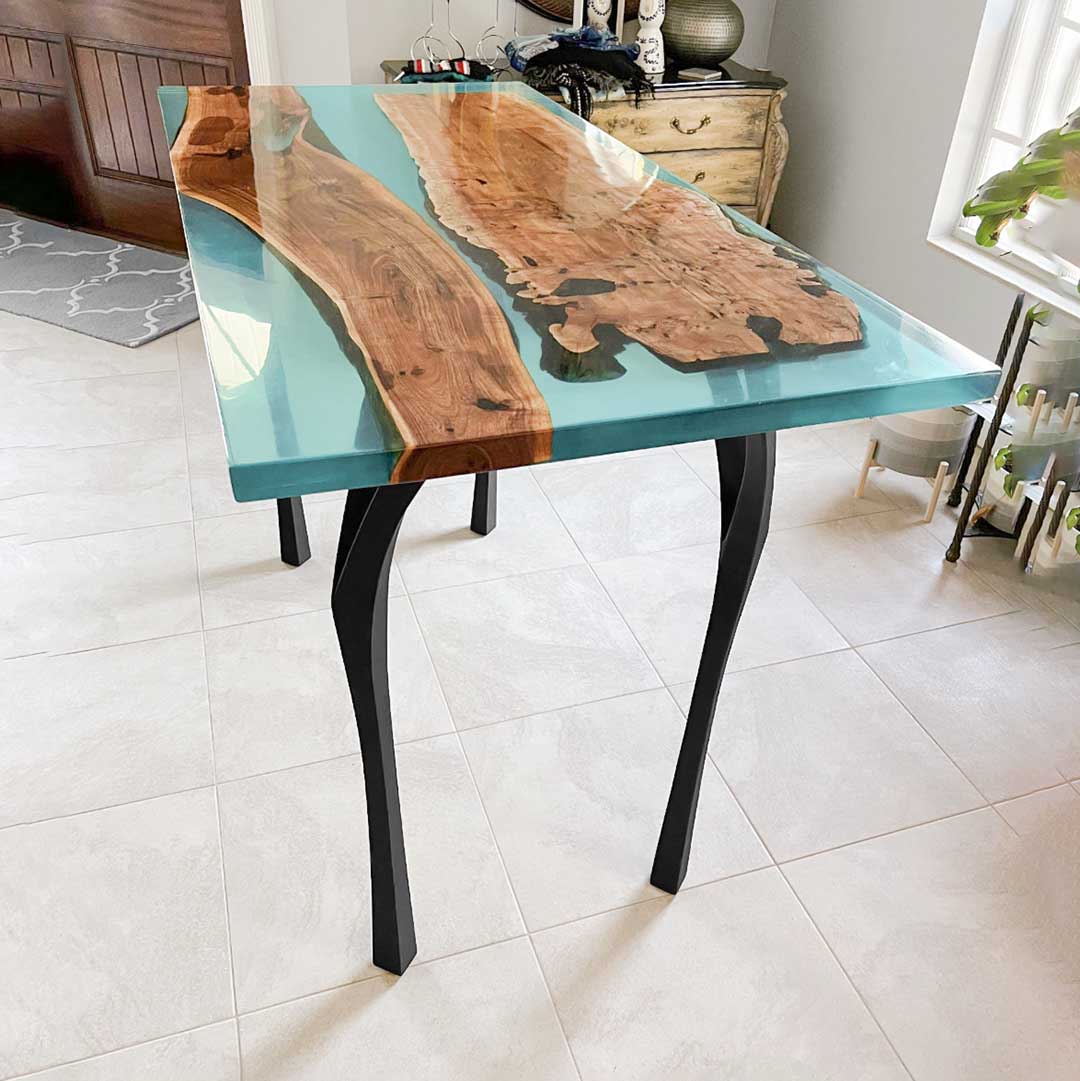 Modern counter table legs 34" H metal with matte black finish in cozy coffee shop setting