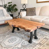 Living room setup with Haru 103 bench legs supporting a reclaimed wood bench