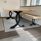 Metal table legs 28" H paired with live-edge wood slab creating rustic modern dining table design