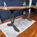 Adjustable leveling feet on metal legs for table ensuring stability on uneven floors and surfaces